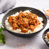 Beef Rendang in a pan with rice